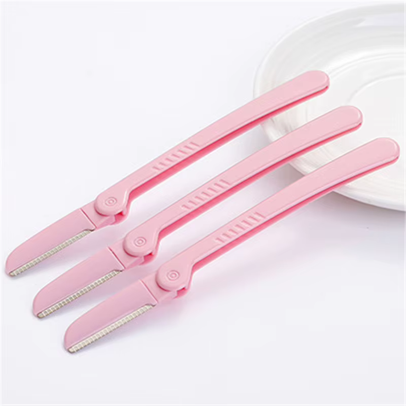 Tondeuse à sourcils pliante rose